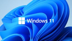 Imagen minimalista con fondo azul y logotipo de Windows 11 para curso gratuito - Generada con IA
